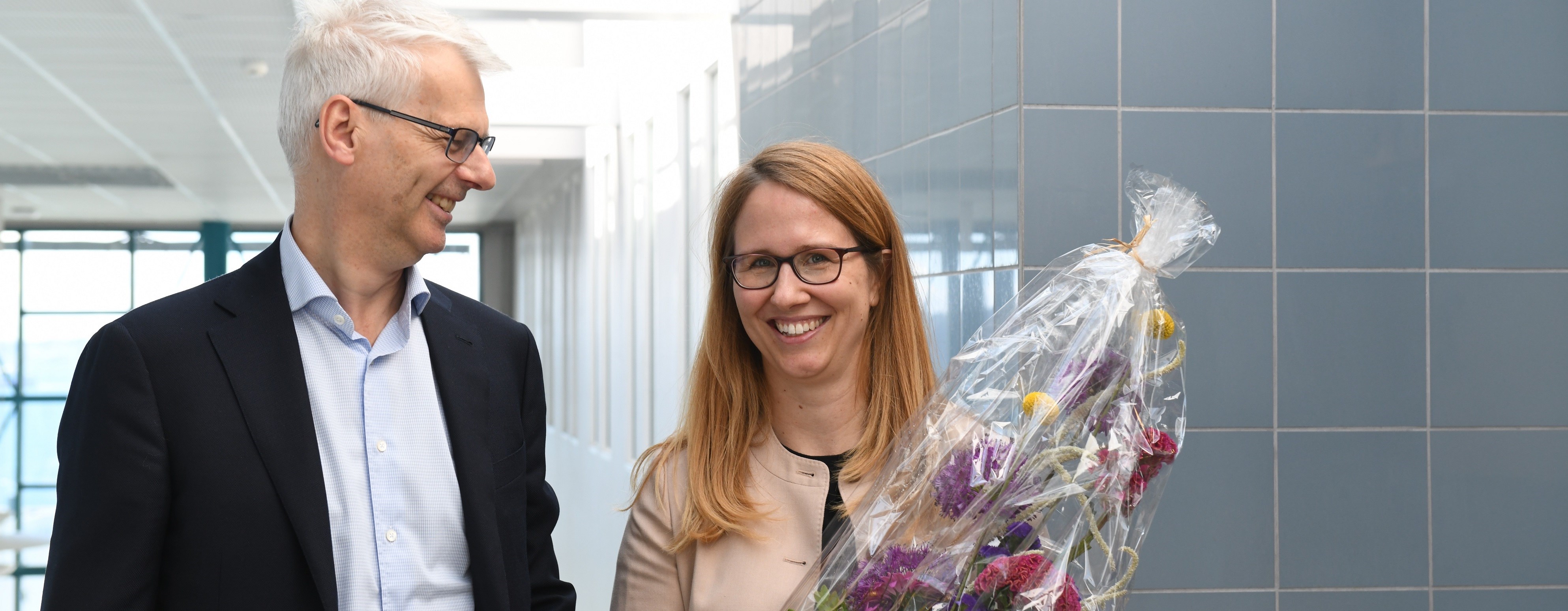 This week Aline Bütikofer was appointed full professor and was congratulated by NHH Rector Øystein. Her research contributes to a growing literature on long-term effects of early investments in children. Photo: Sigrid Folkestad