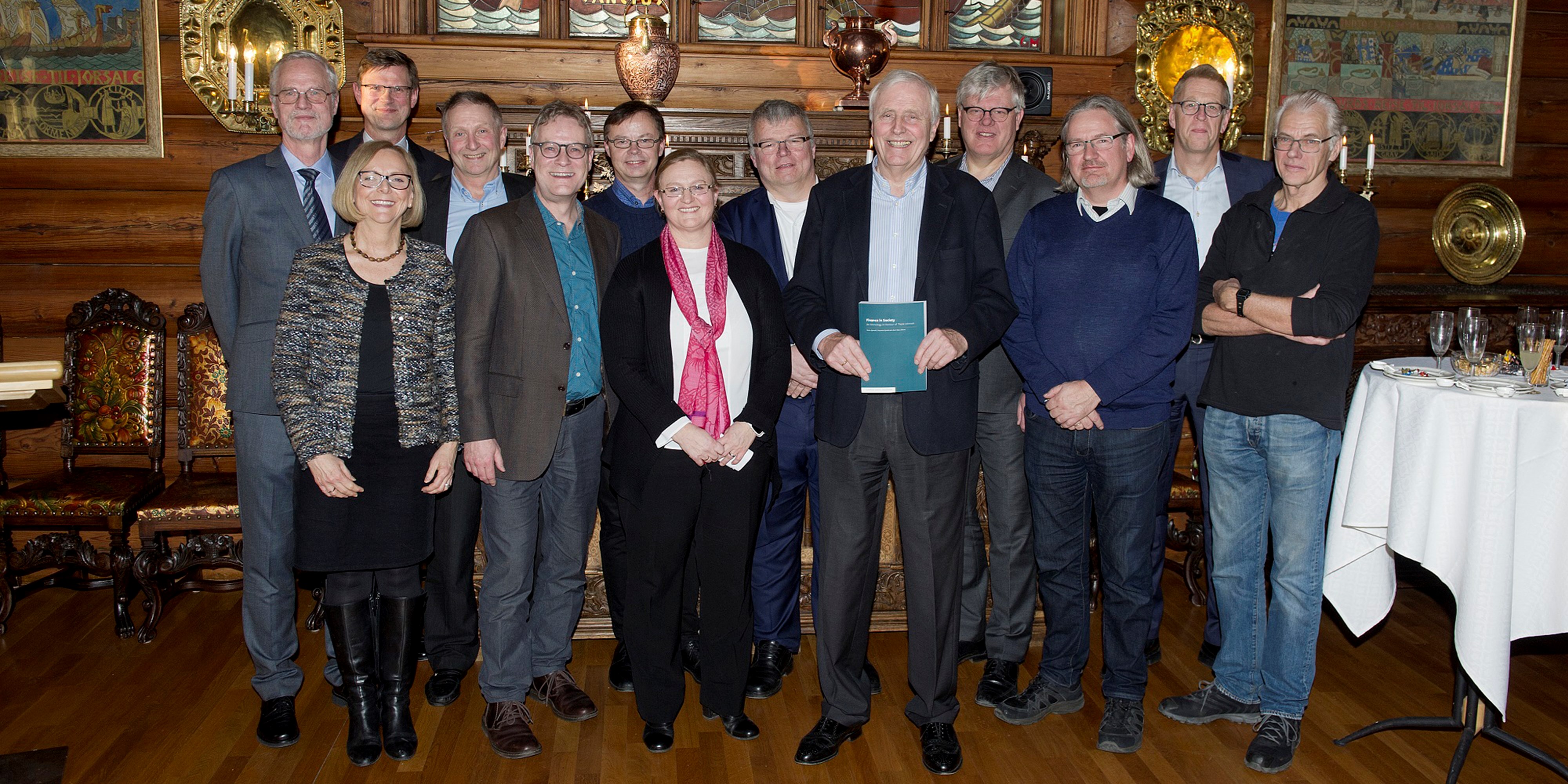 Thore Johnsen together with some of the contributors to “Finance in the Scoiety. From left to right: NHH Rector Frøystein Gjesdal, Publishing Director Birgit Skaldehaug from Cappelen Damm Akademisk, Associate professor Aksel Mjøs, Profesor Ole Gjølberg from NMBU/NHH, BI professor Christian Riis, Professor Petter Bjerksund, Professor Mette H. Bjørndal, Partner Lars Inge Pettersen from KPMG, Thore Johnsen, Partner Erik Mamelund from EY, BI Professor John Chr. Langli, Associate professor Finn Kinserdal, and Professor Knut K. Aase.