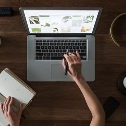 Person writing on computer