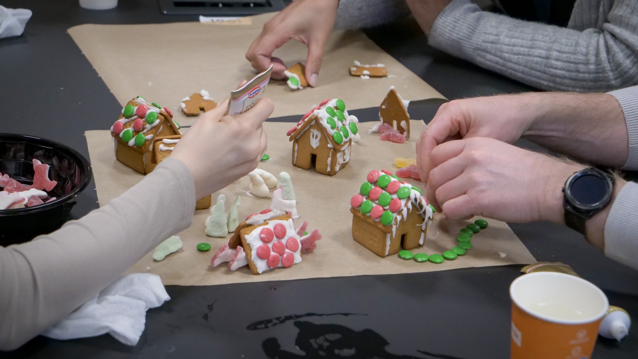 Ginger bread houses being decorated