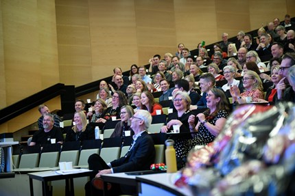 The audience smiling