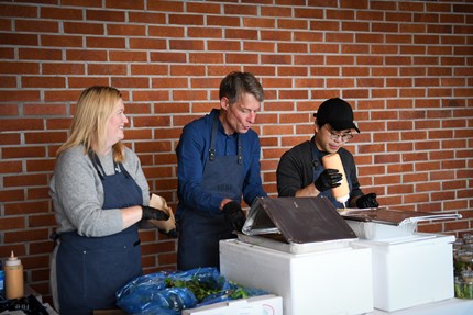 Employees preparing food for the students.