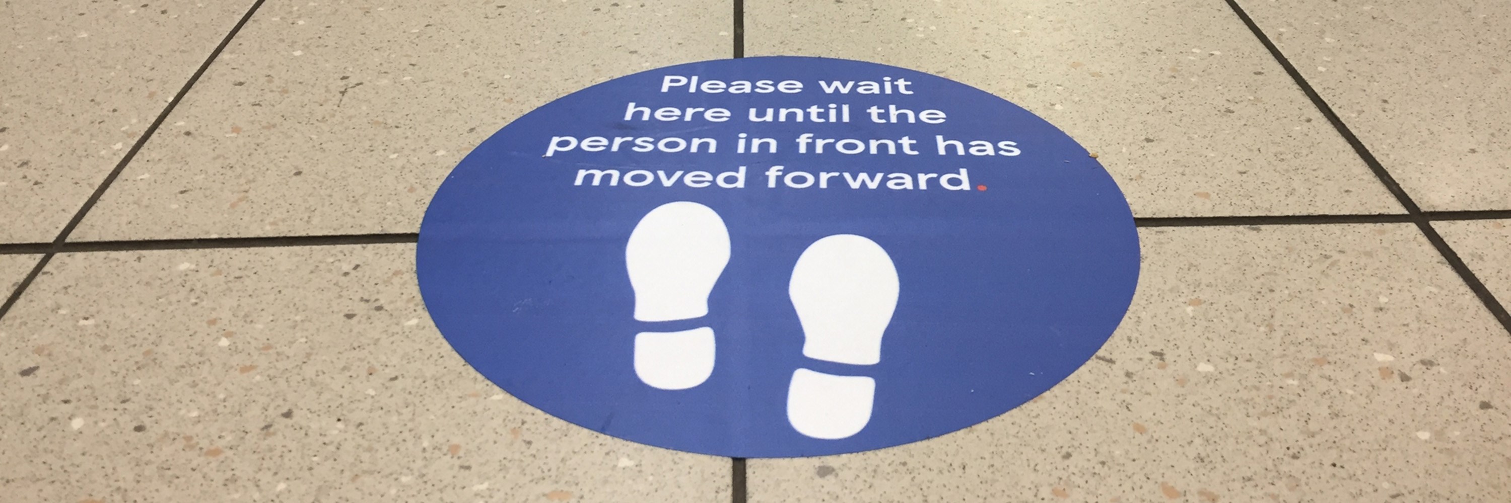A grocery store distancing floor sign. Photo: Lorna Roberts