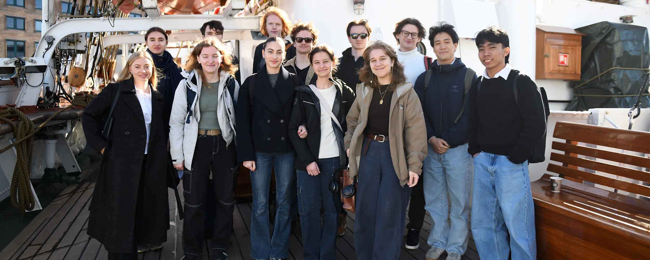 A class from Bergen Katedralskole lined up on deck aboard the Statsraad Lehmkuhl docked in Bergen.
