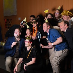 NHH eployees taking a group photo at an Autumn Party