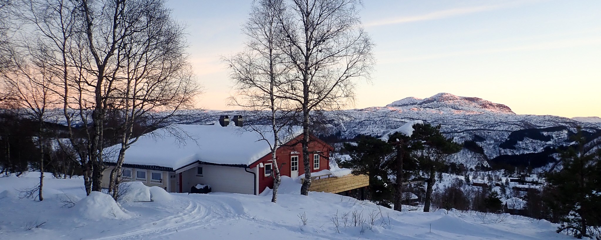 The cabin in snow on a beautiful sunny day