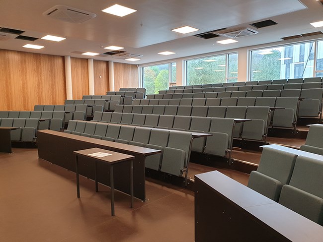 Auditorium on the ground floor with new surfaces and interior.