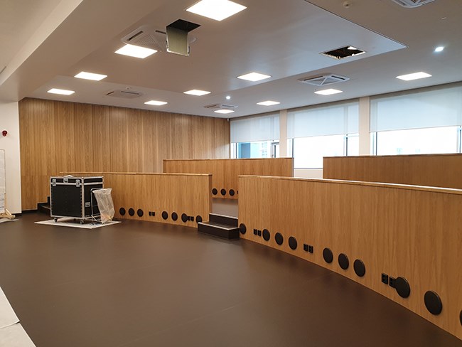 Collaboration auditorium on the ground floor in the low building. The room will be furnished with group tables.