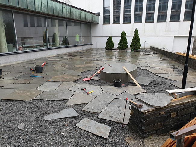 Laying of new slate and foundation for new art on the terrace.