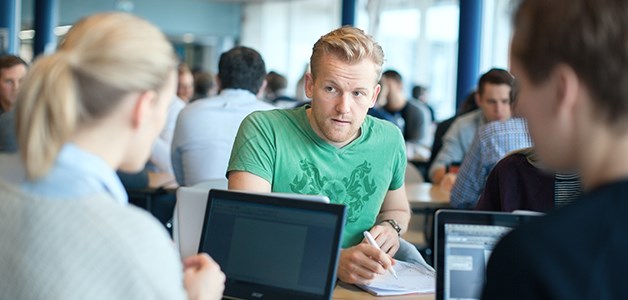 Students working around a table