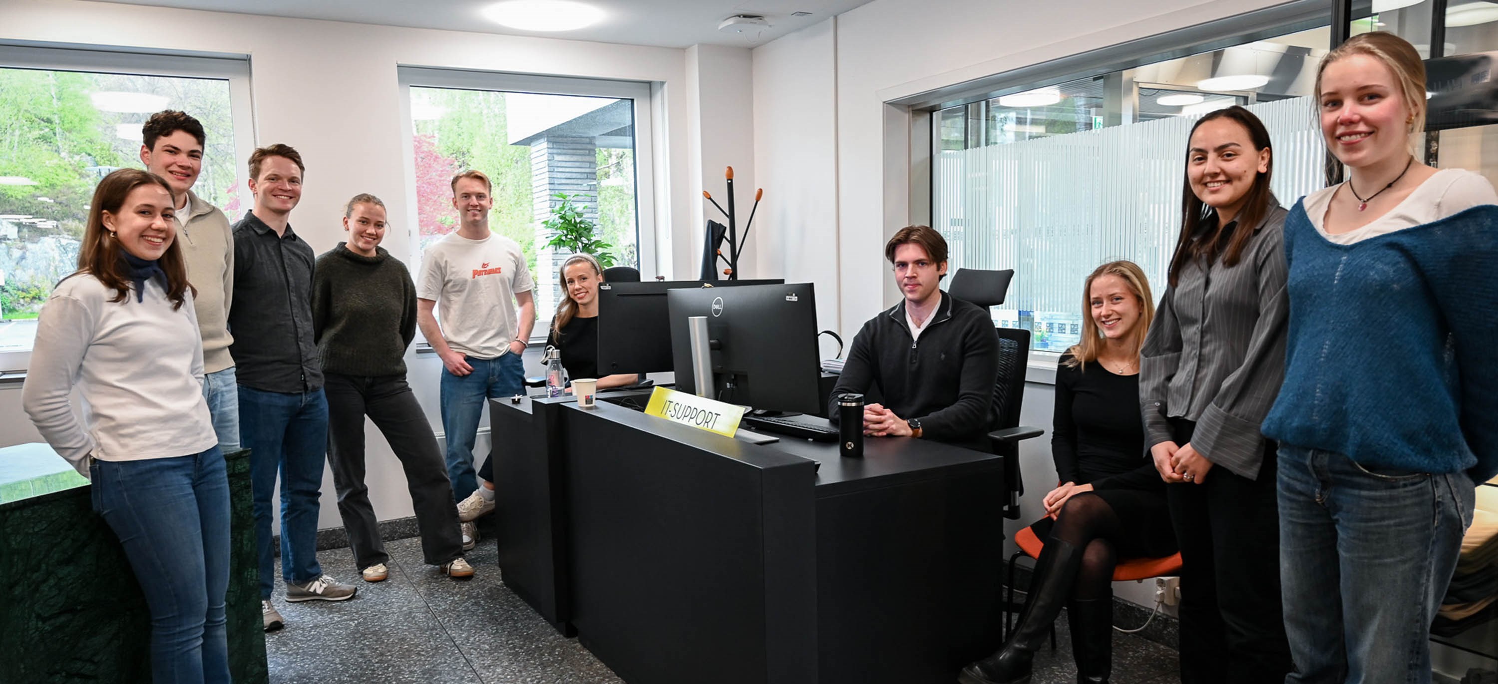 Ten of the 16 students who comprise NHH's first line of IT Support gathered in their "HQ" in the Service Centre.