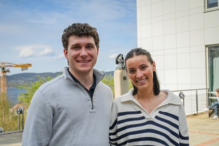Students standing outside NHH campus