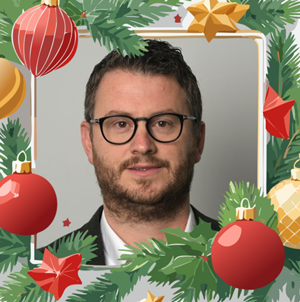 Portrait photo of Lulzim with Christmas frame around