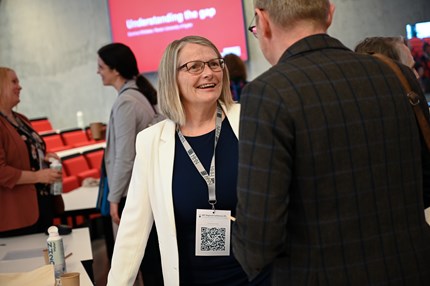Sunniva Whittaker talking to a colleague