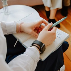 person holding note book