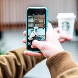 cell phone picture of Starbucks coffee cup.  Photo: Douglas Barr/unsplash.com