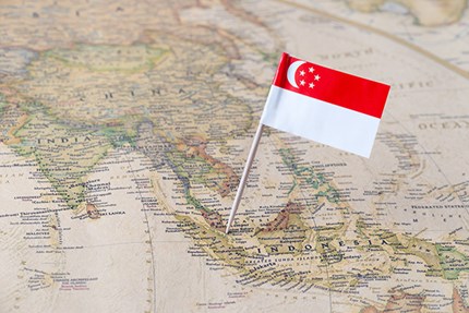 Asia map and Singapore's flag. Photo: Sjankauskas/ Dreamstine