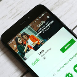 Grab inc app. Photo: RFaizal707/Dreamstime