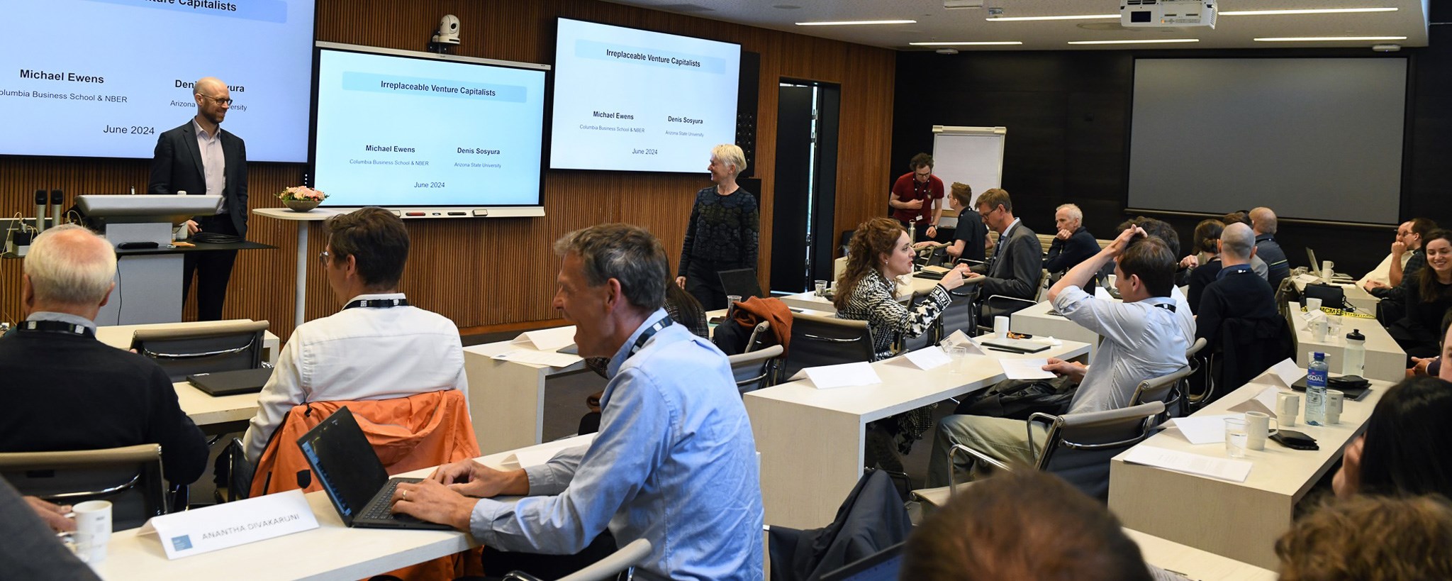 the participants of the conference discuss in the conference room