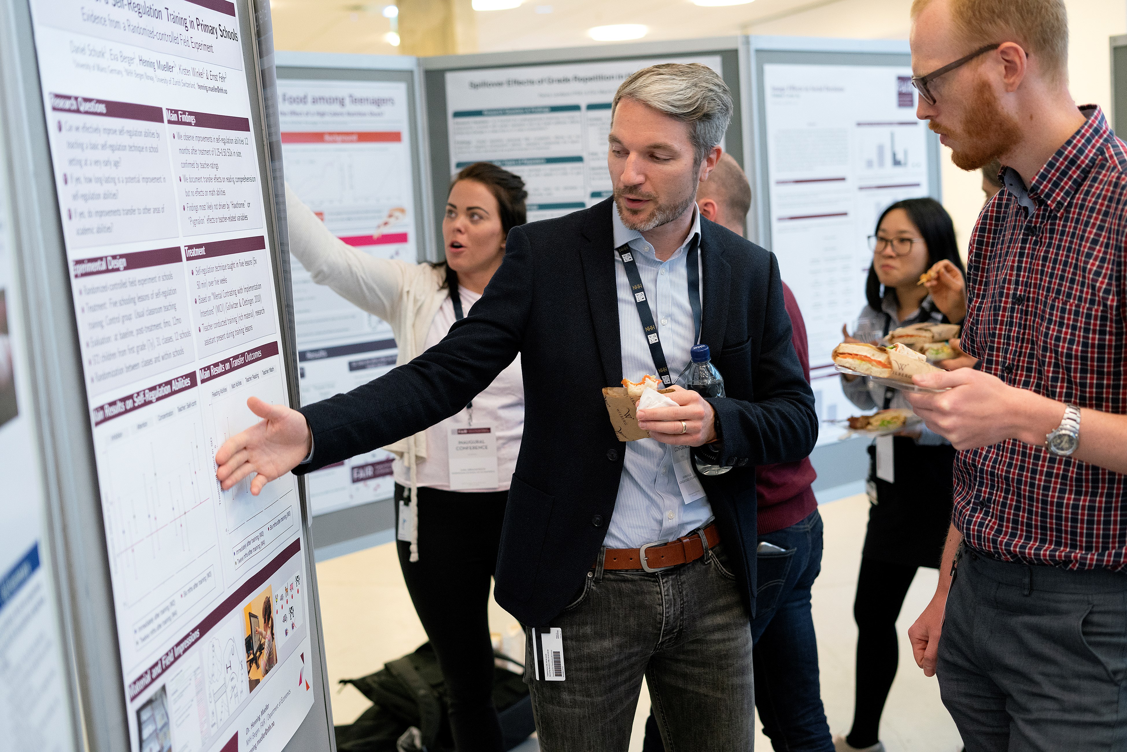Henning Müller and Sigbjørn Råsberg at the poster session at FAIR Inaugural Conference.
